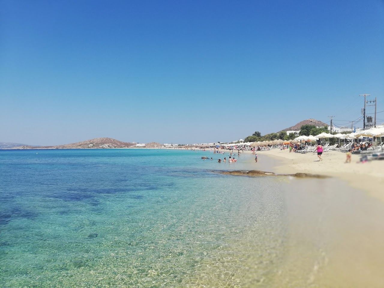 Soft golden sand and calm blue water at Agios Prokopios beach on Naxos in Greece
