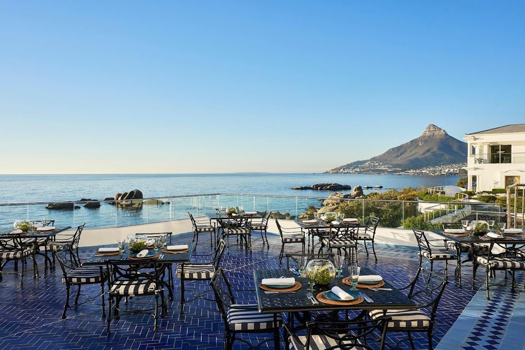 Camps Bay beach below the Twelve Apostles mountains in Cape Town, South Africa