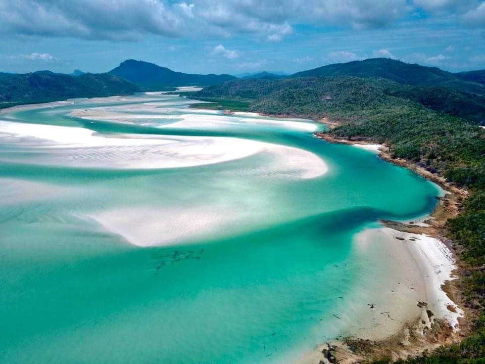 Swirling white silica sand and turquoise water at Hill Inlet above Whitehaven Beach in the Whitsundays