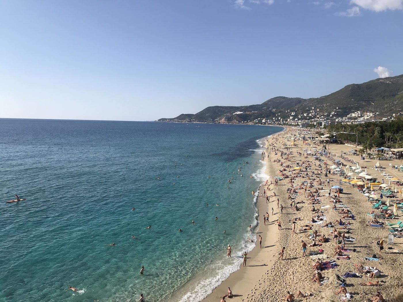 Fine sand and calm water at Damlatas Beach beside the cave in central Alanya