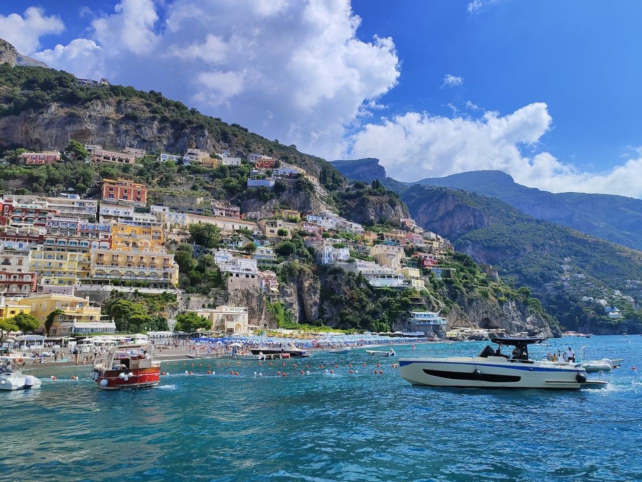 Cliffside pastel houses above the sea on the Amalfi Coast in Italy