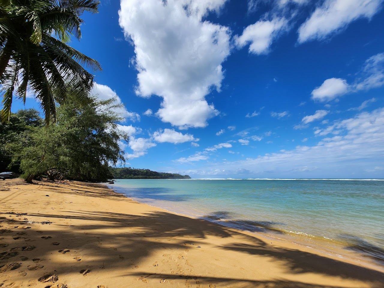 The wide reef lagoon and shallow turquoise water off Anini Beach Park on the north shore of Kauai