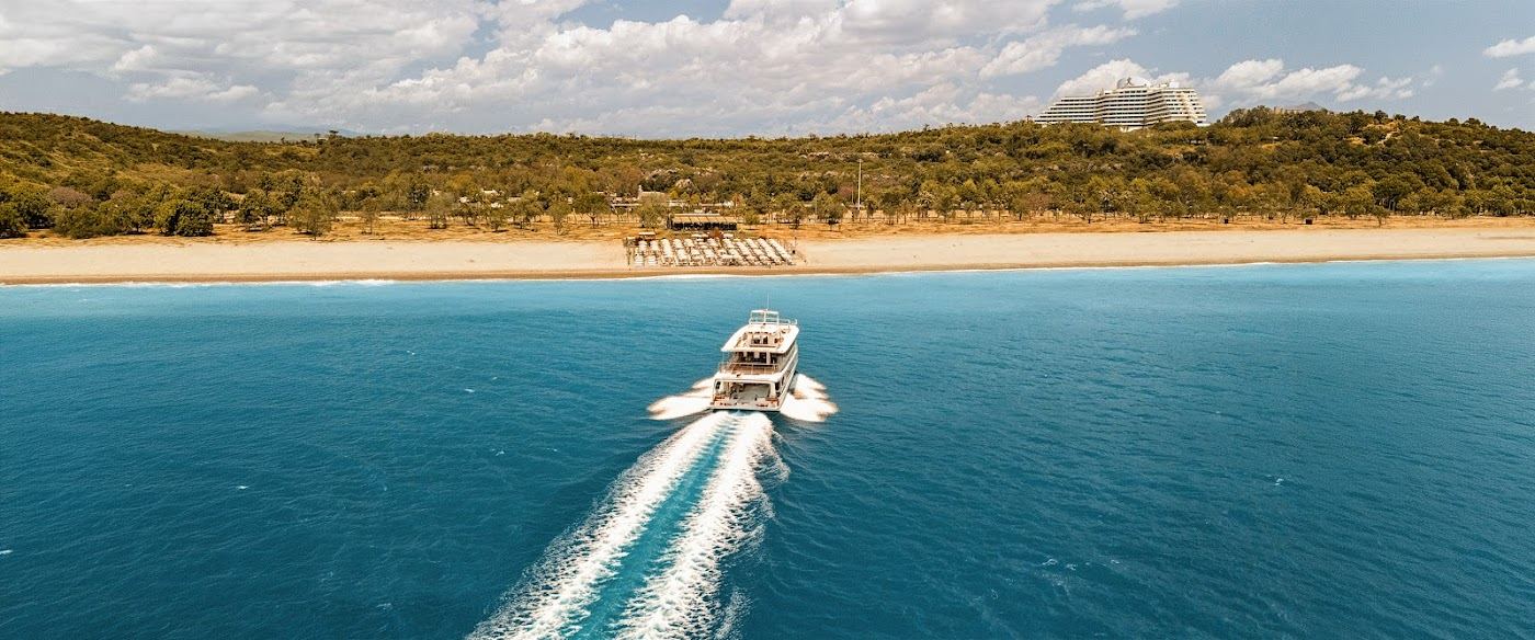Sunbeds and a relaxed beach lounge on the Antalya shore in Turkey