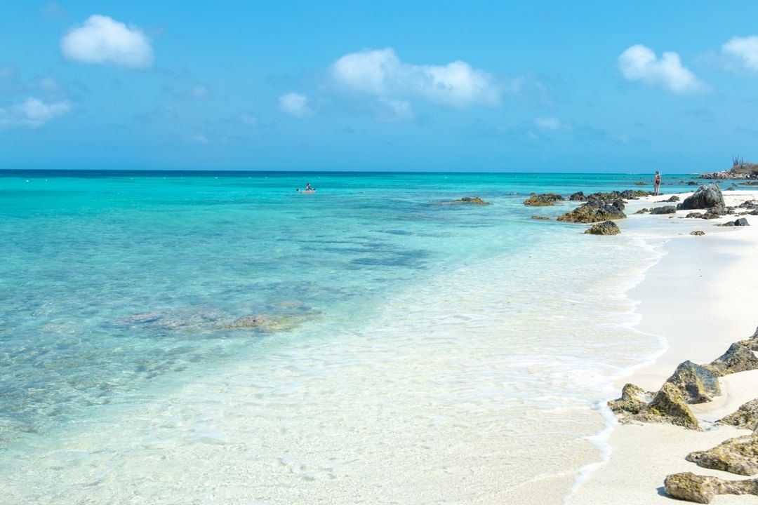 Shallow clear water and pale sand at the sheltered cove of Boca Catalina near Malmok in Aruba