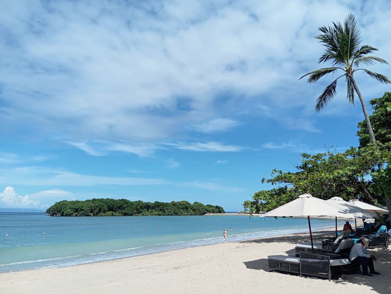 Flat clear water over pale sand inside the reef at Nusa Dua in southern Bali