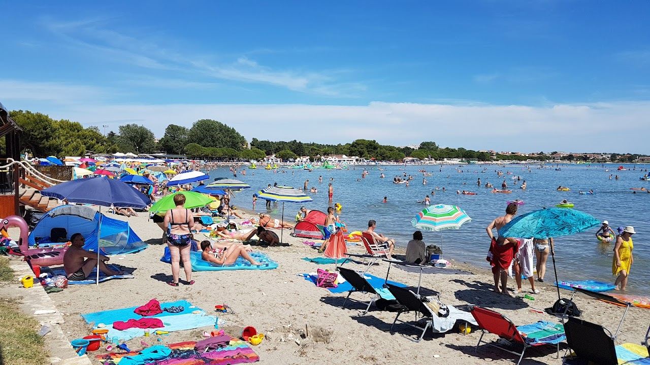 Rare sandy shallow beach at Bijeca in Medulin in southern Istria