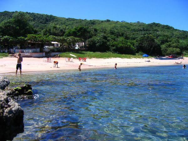 The calm sheltered cove of Praia do Forno reached on foot or by boat on the eastern side of Buzios