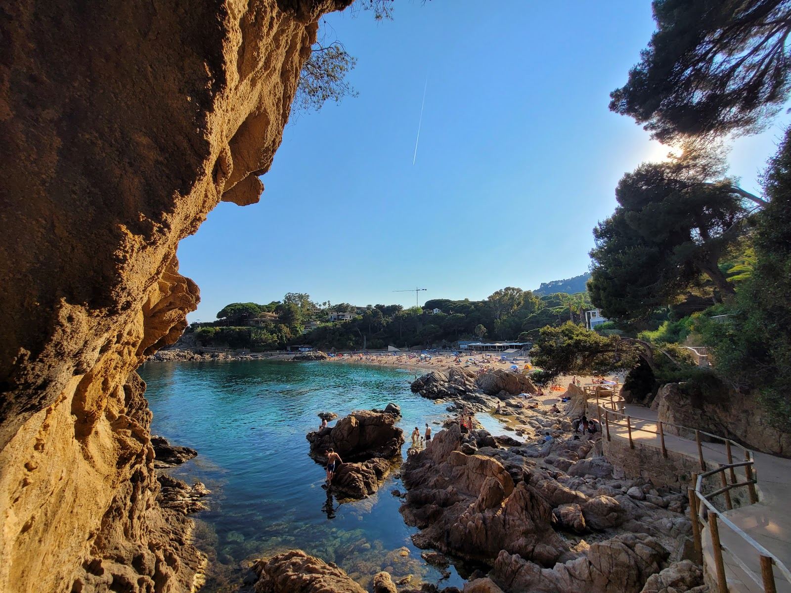 Sheltered golden sand and calm water of Cala Sant Francesc near Blanes on the Costa Brava