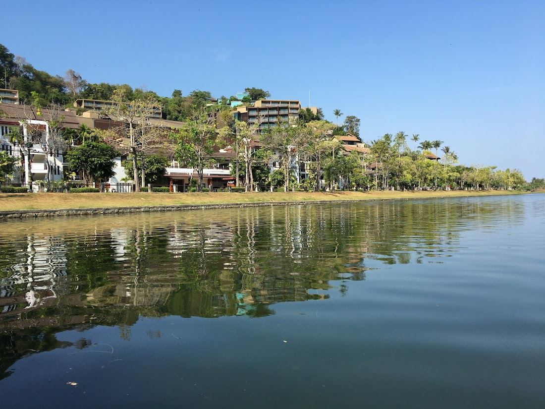 The headland framed bay and clear water of Nai Harn in southern Phuket