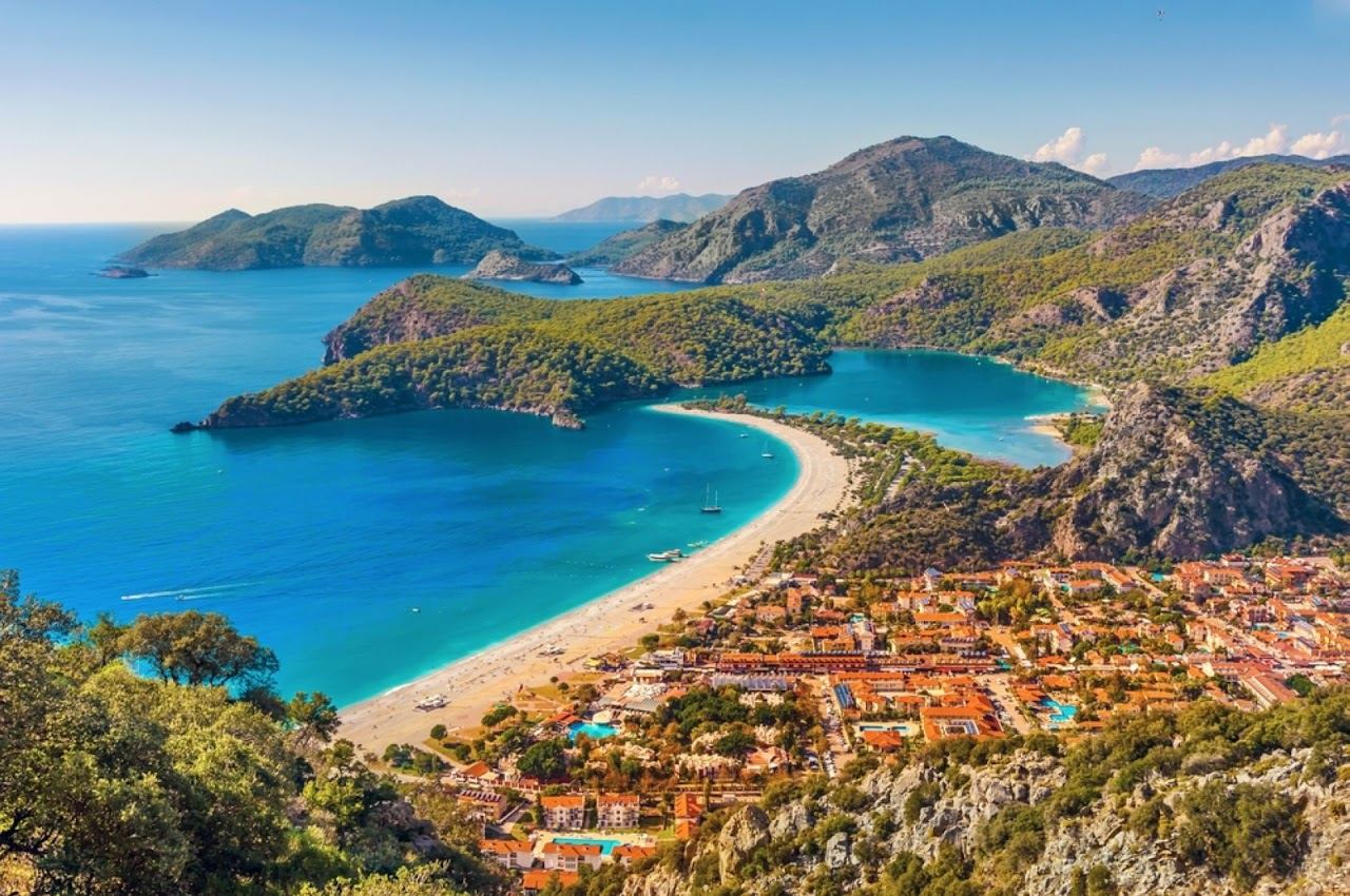 The still jewel coloured water of the Blue Lagoon at Oludeniz in Turkey