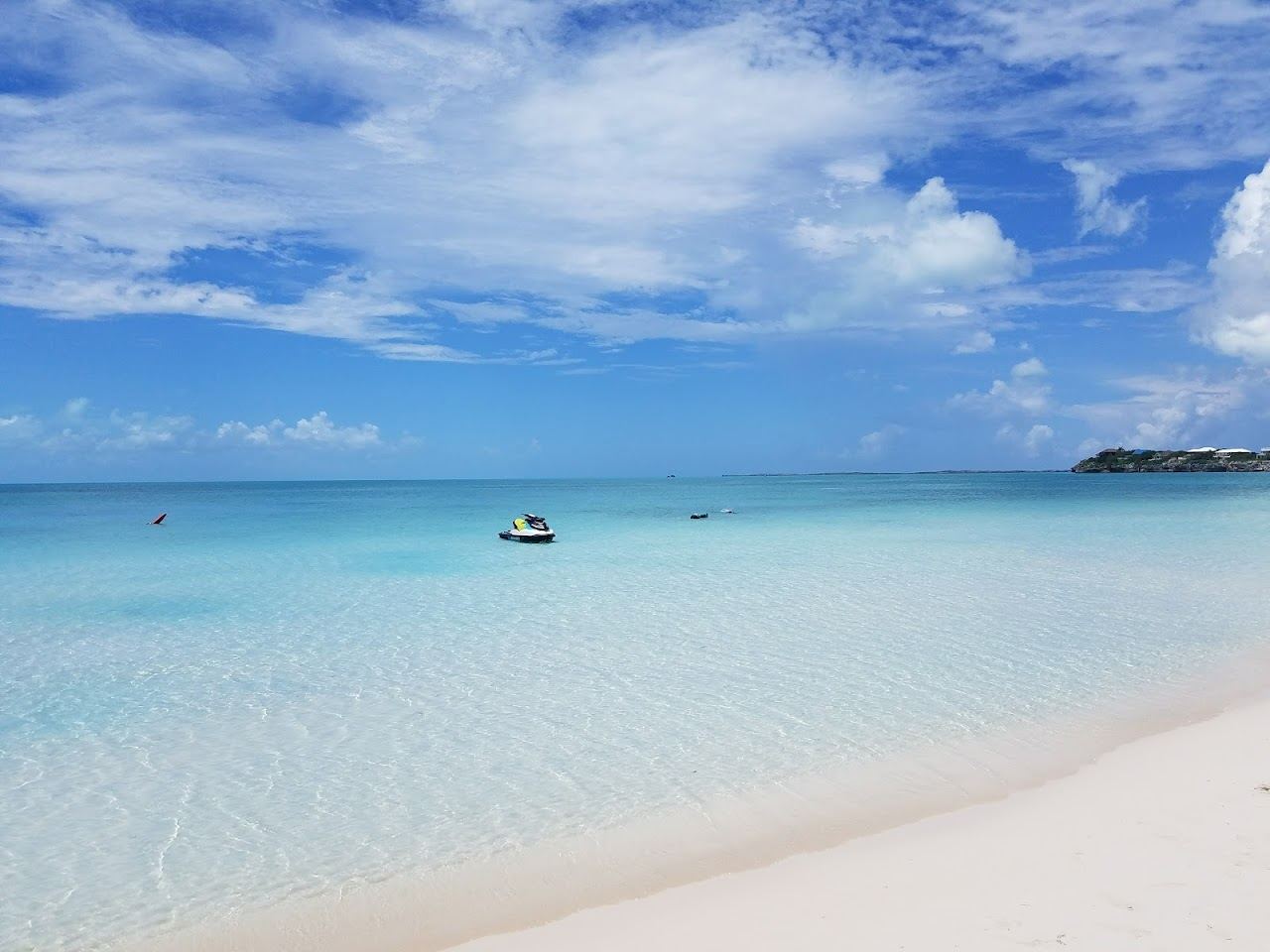 The millpond shallow water of Sapodilla Bay on Providenciales