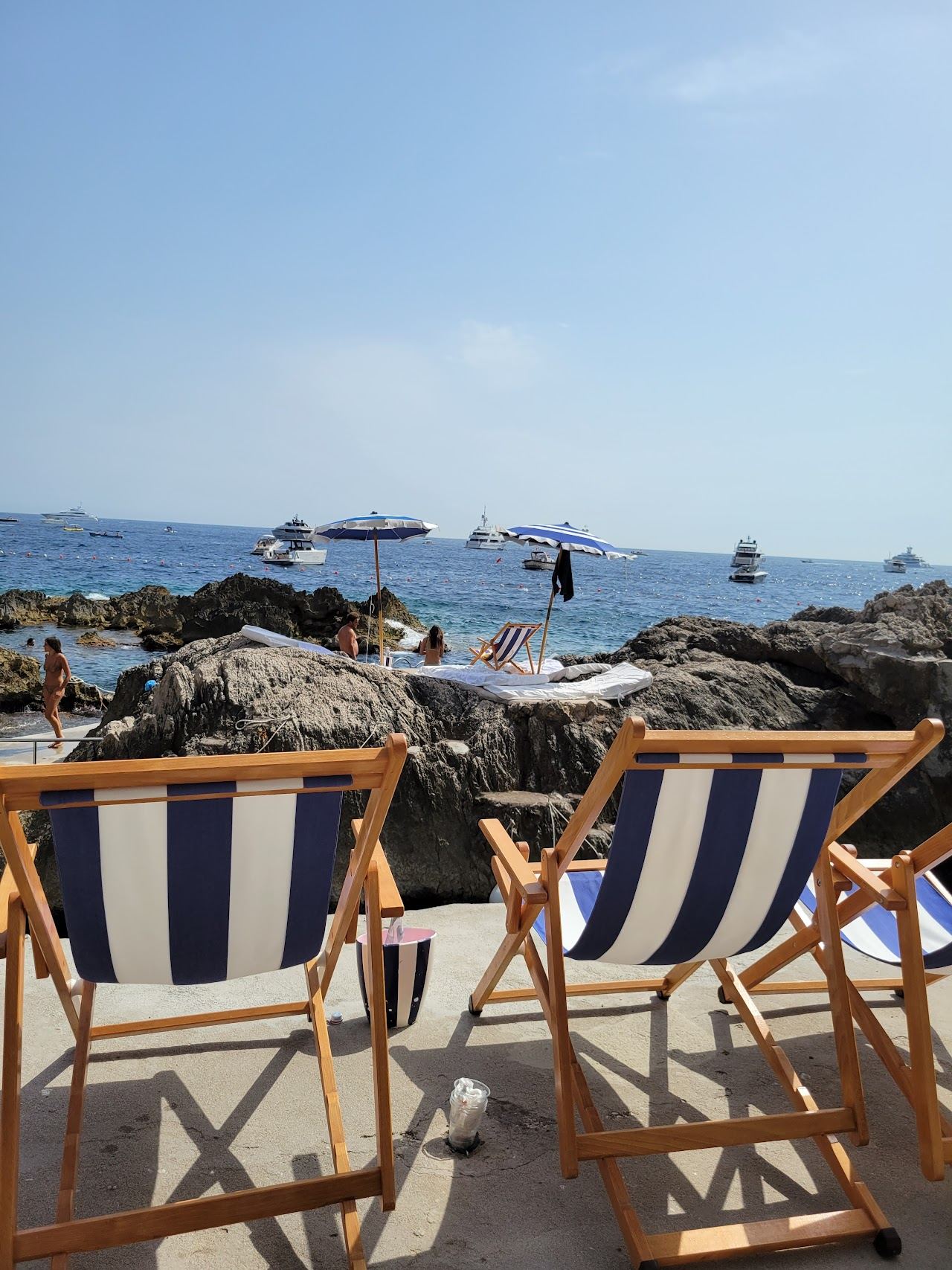 Deep blue water on the rocks below the Faraglioni at La Fontelina in Capri