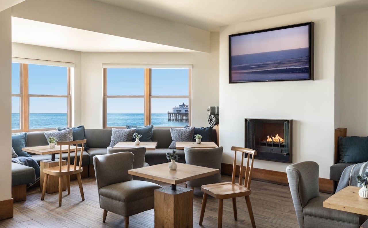 Oceanfront deck of the Carbon Beach Club restaurant beside the sand in Malibu