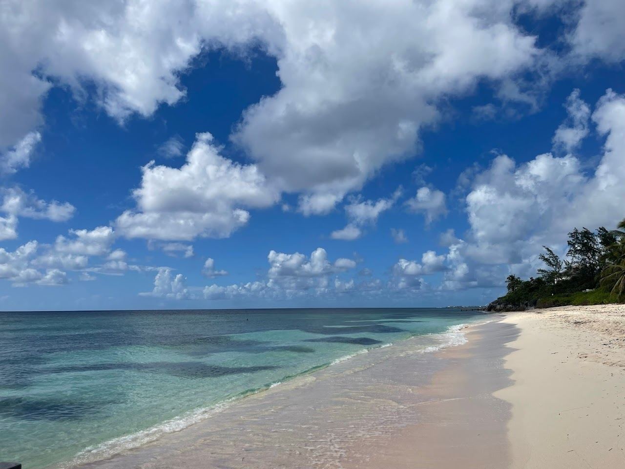 Calm clear water over turtle grass shallows at Spotts Beach on the South Sound of Grand Cayman