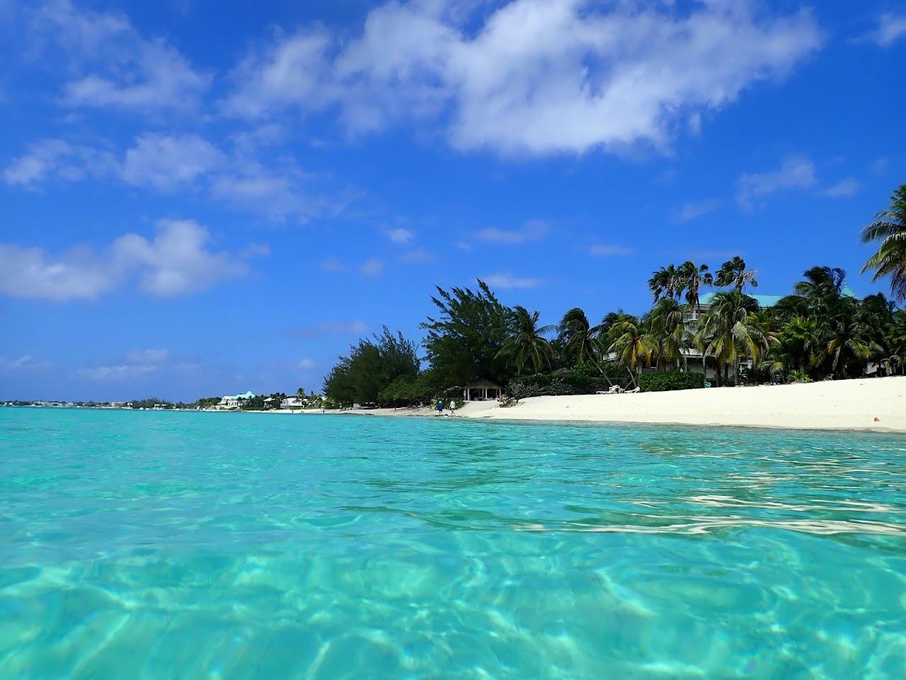 Quiet powdery white sand and calm clear water at West Bay Public Beach on the north of Seven Mile Beach Grand Cayman