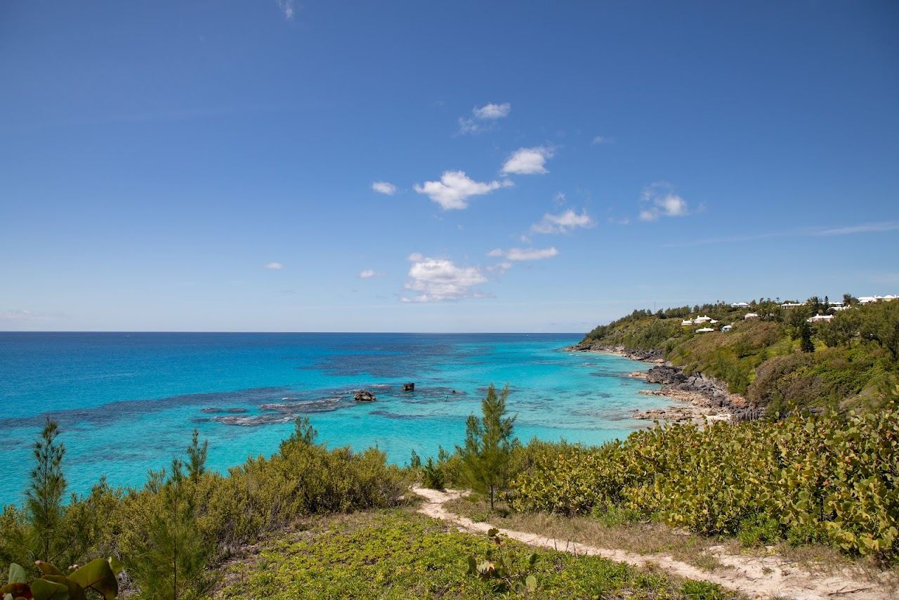The reef water and pink sand cove of Church Bay seen from the steps above in Southampton, Bermuda