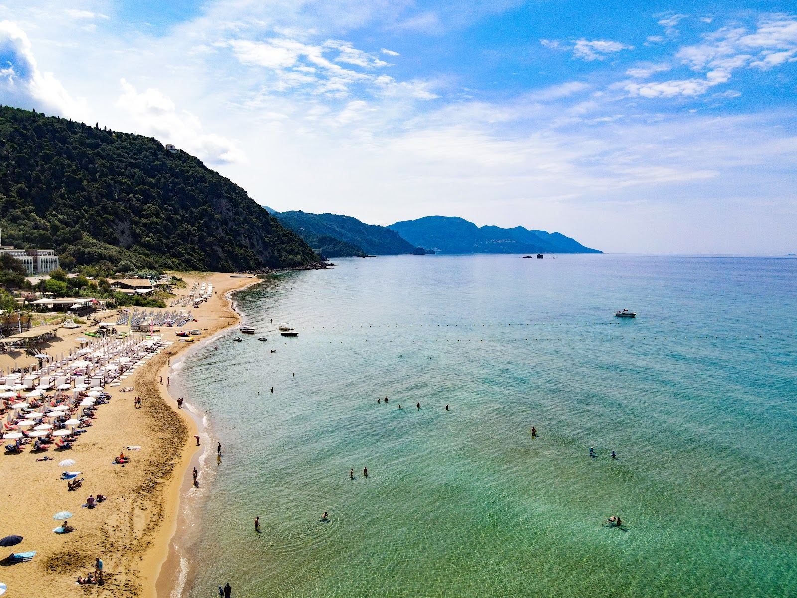 Daybeds and sunbeds at a beach club in Corfu