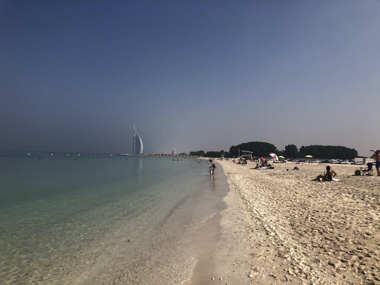 The undeveloped sand and quiet clear water of Black Palace Beach in Dubai