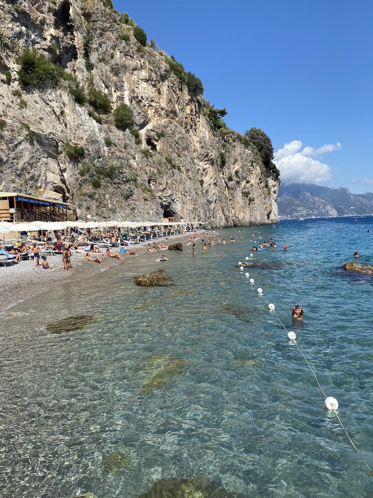 Duoglio beach in a cliff backed cove west of Amalfi with clear water