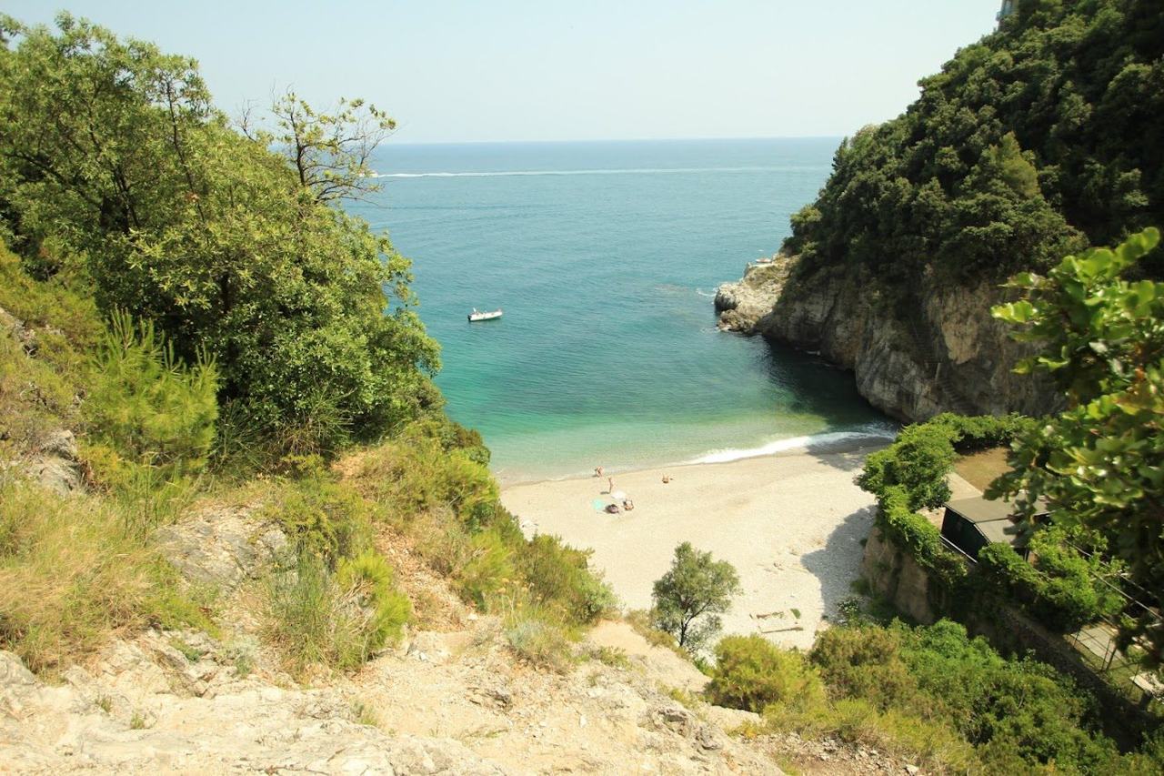 The hidden cove of Erchie below its watchtower