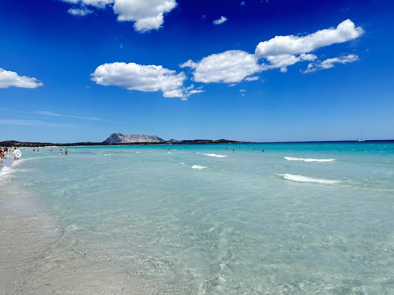 The long shallow white sand bay and warm flats of La Cinta in Sardinia