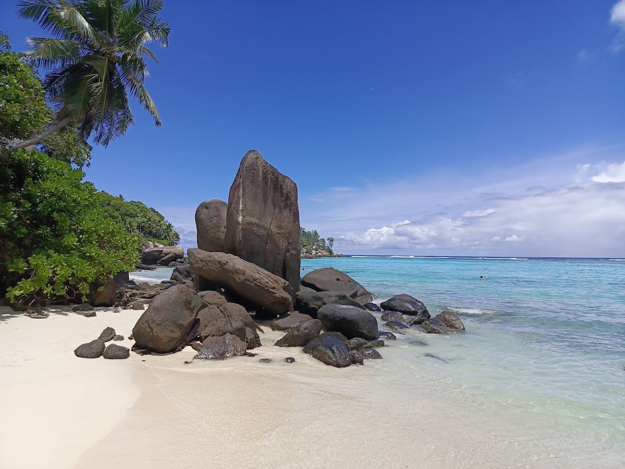The shallow reef protected lagoon and village feel of Anse Royale on Mahe