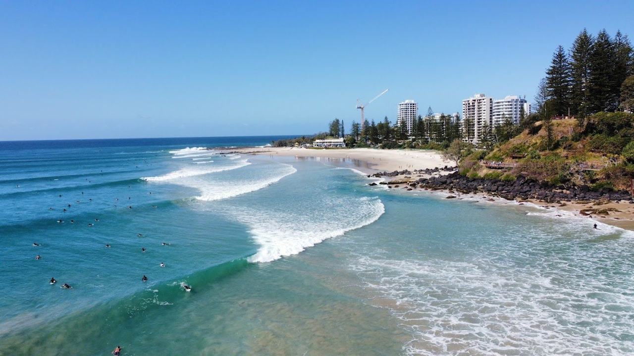 The sheltered curve of sand below Greenmount headland at Coolangatta
