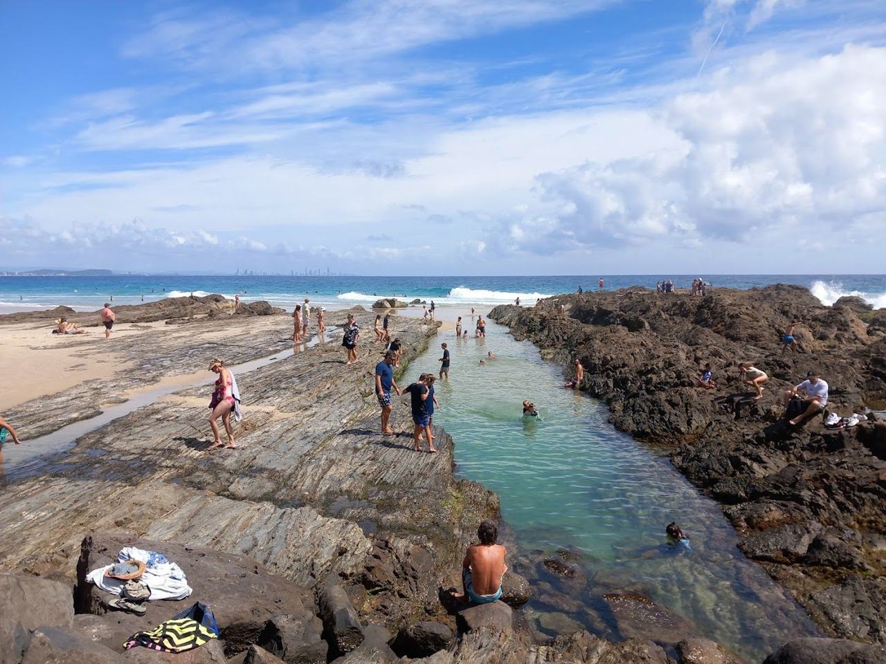 Surfers in the water near the point at Snapper Rocks on the southern Gold Coast Queensland