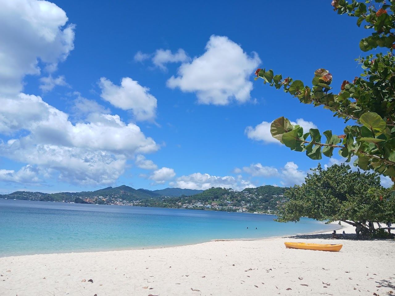 Calm golden sand and gentle leeward water at Grand Mal Beach north of St George's in Grenada