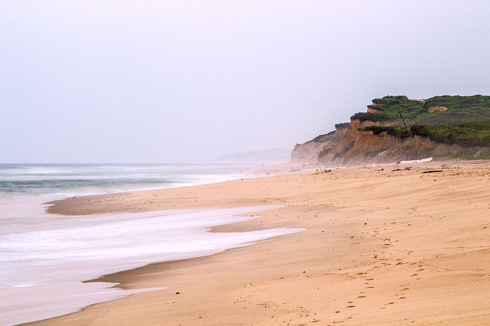 Surfers and open sand at Ditch Plains beach a short drive east of Gurney's