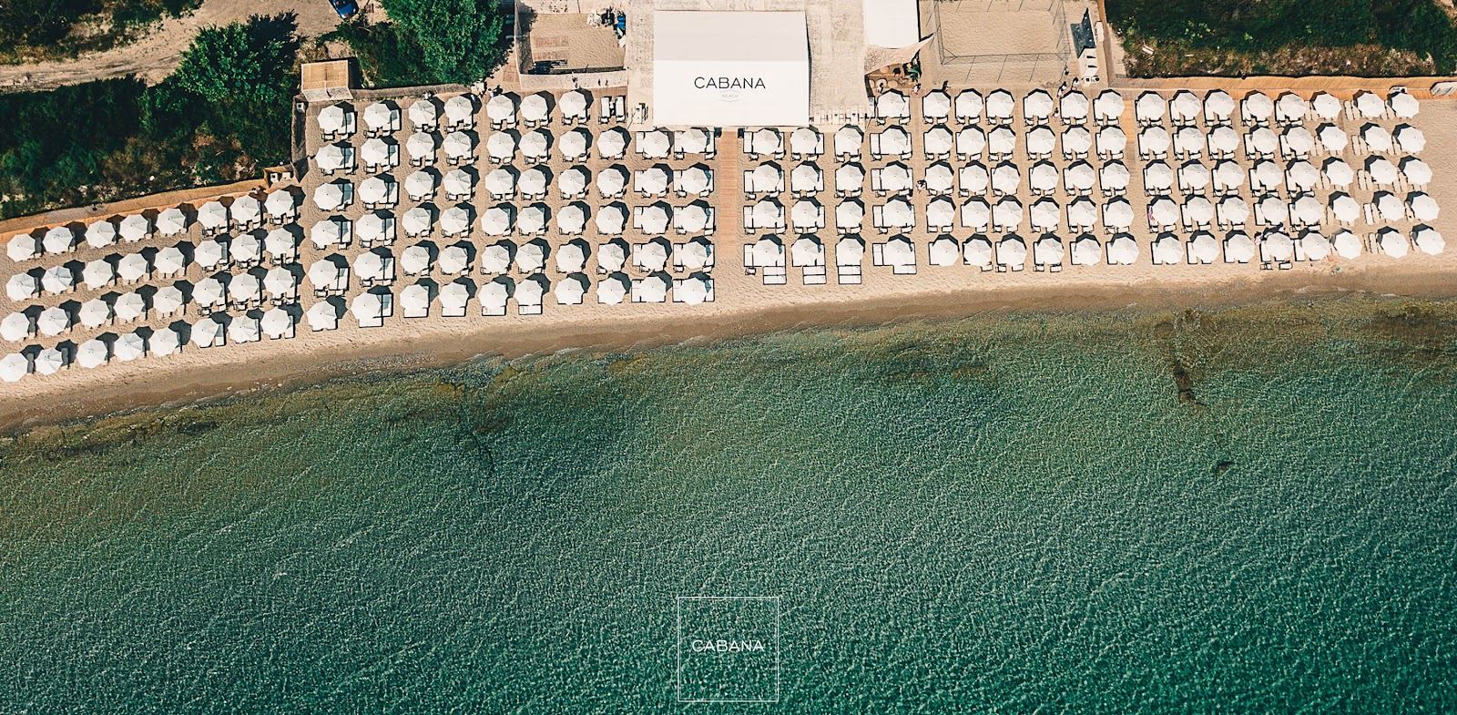 Daybeds and sunbeds at a beach club in Halkidiki