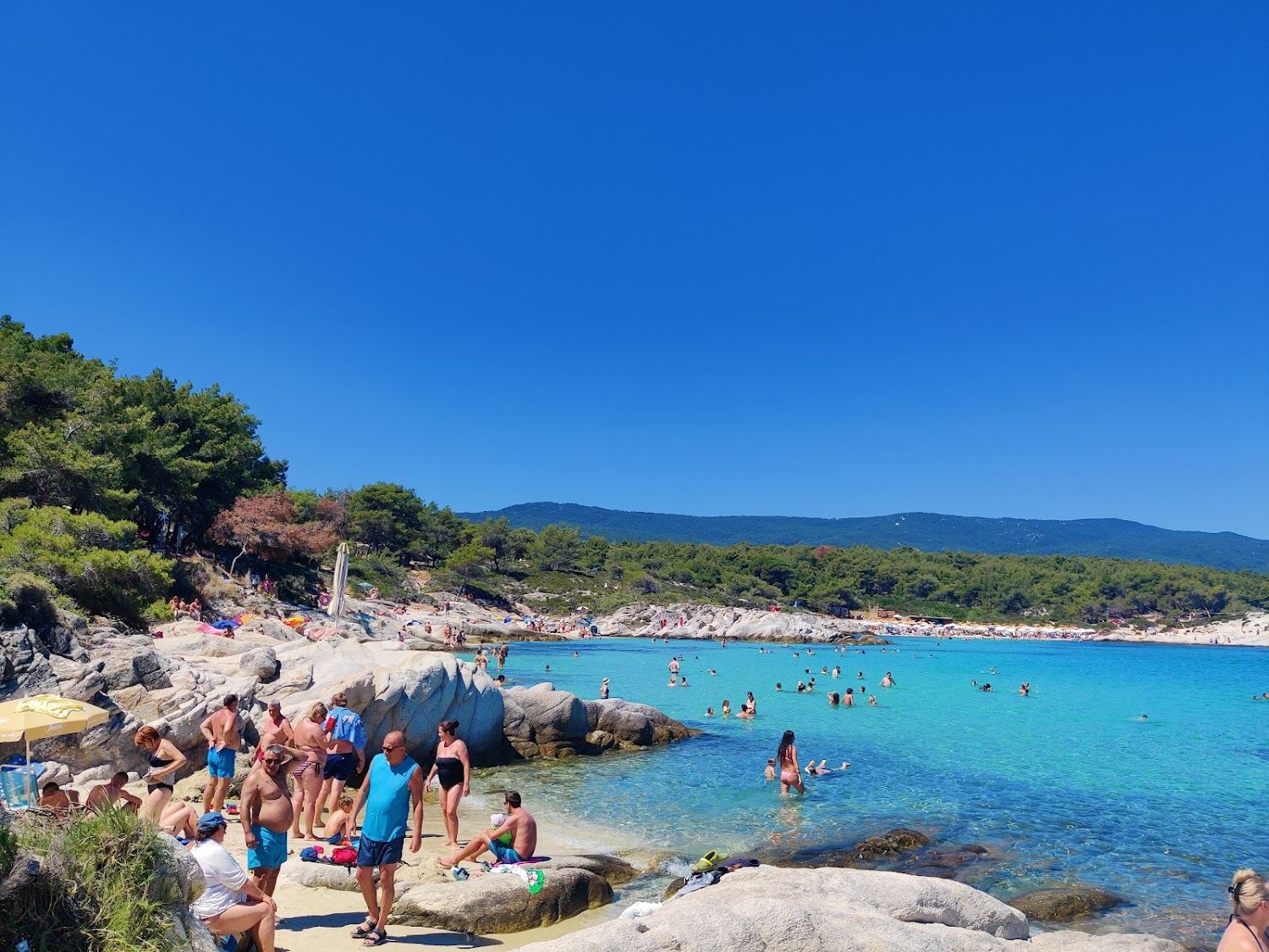 Quiet sculpted white rock coves and clear turquoise water at Kavourotrypes on Sithonia in Halkidiki