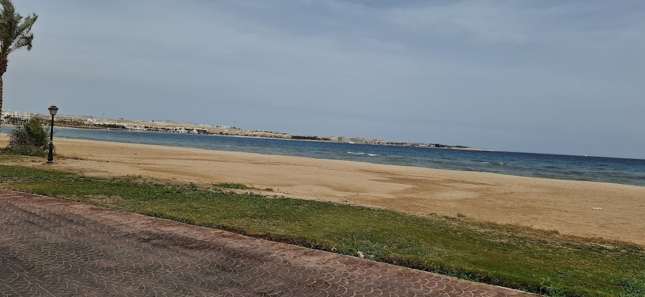 The calm clear water and promenade of the horseshoe bay at Sahl Hasheesh near Hurghada on the Red Sea in Egypt