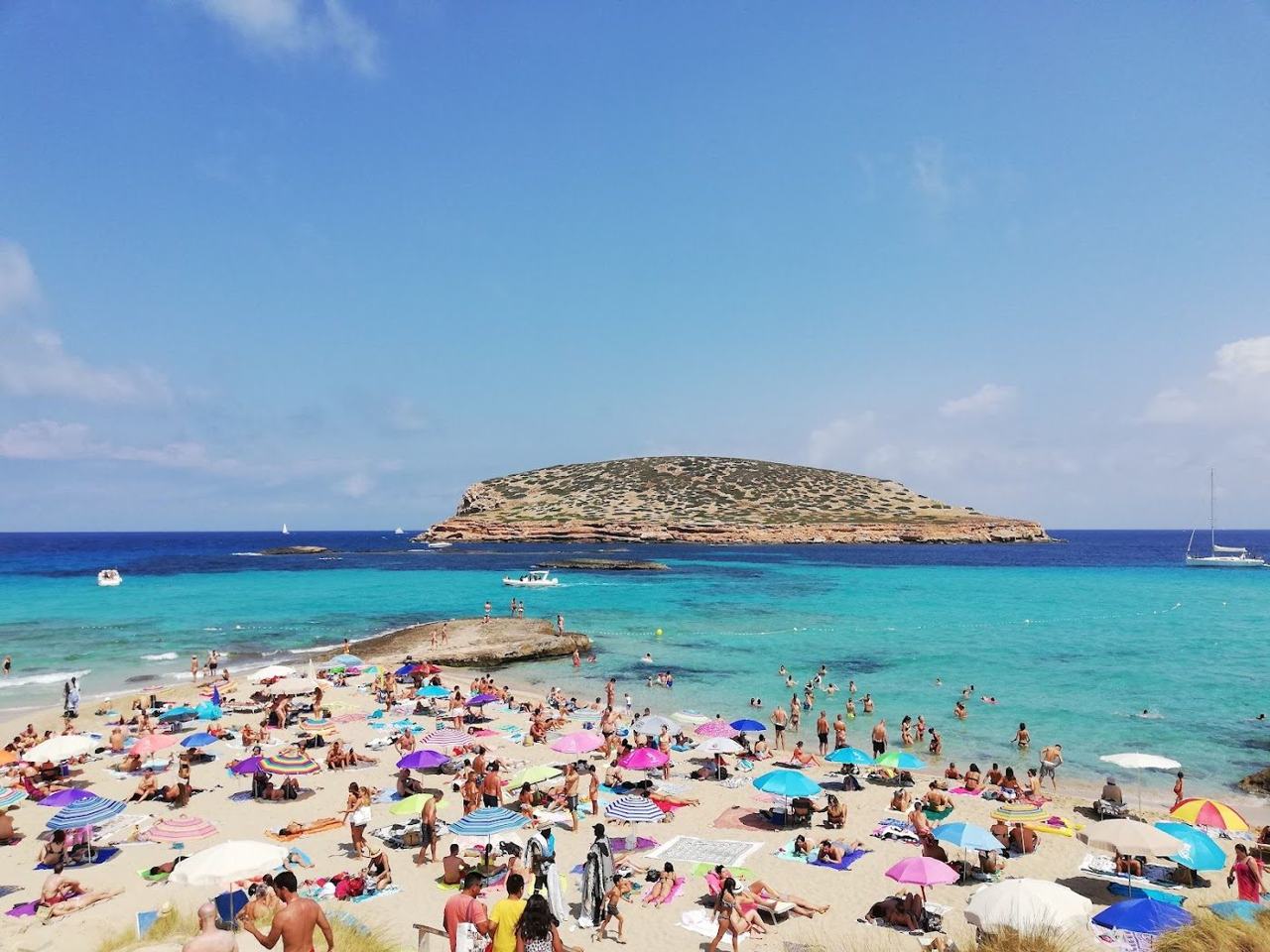 Turquoise water and low rocks at a cove on the west coast of Ibiza