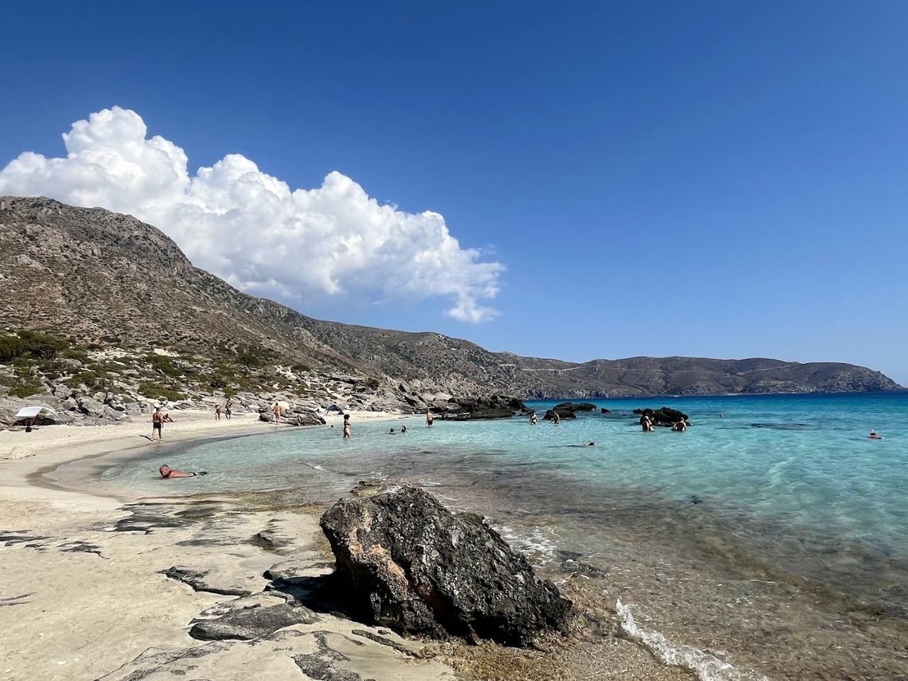 Turquoise shallows and pale sand backed by juniper trees at Kedrodasos in west Crete