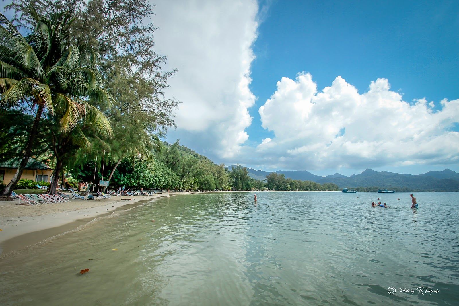 Klong Prao beach on Koh Chang, a long open sweep of soft sand and calm dry season water backed by palms in Thailand