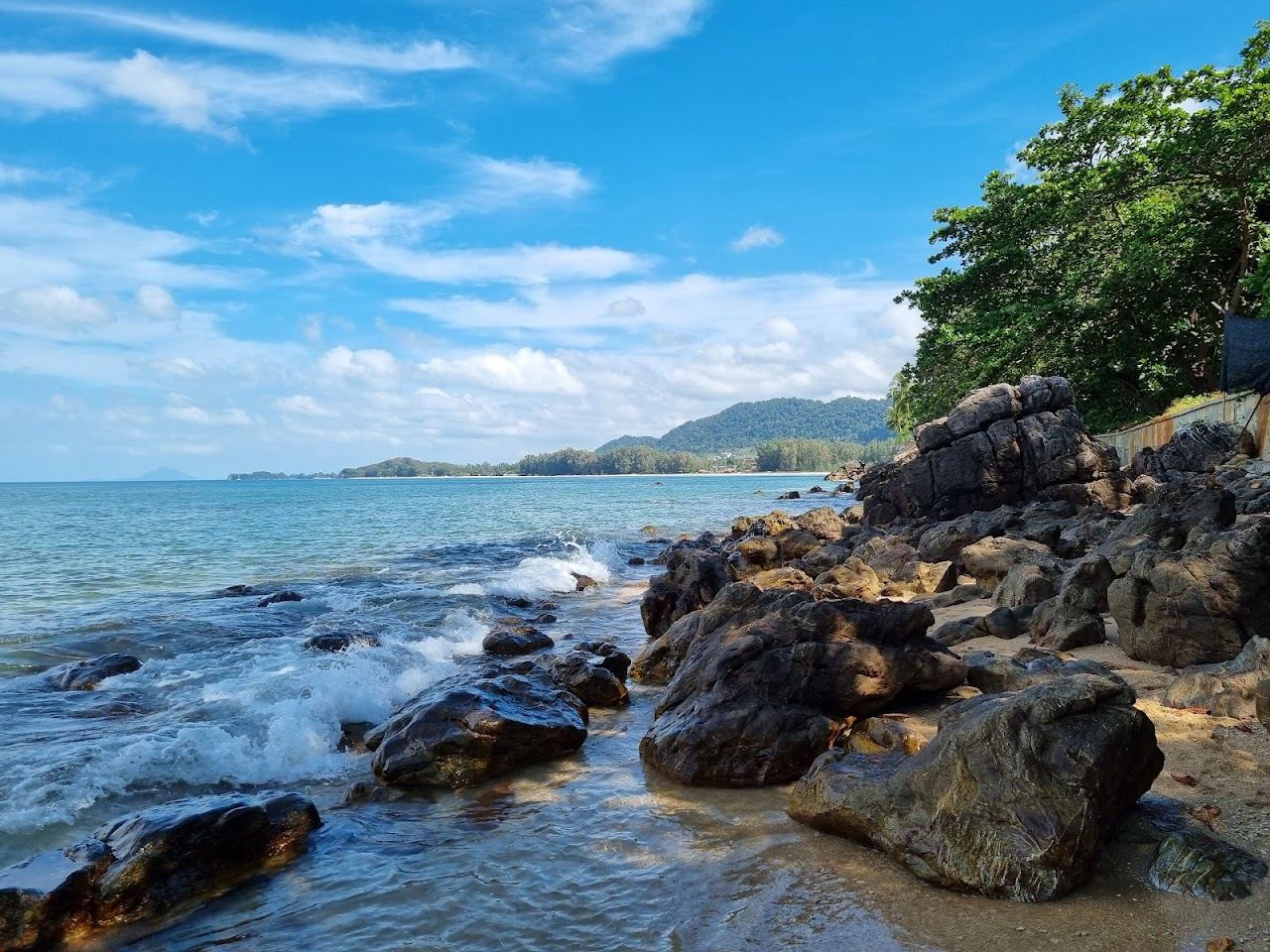 Small quiet cove between green headlands at Relax Bay on Koh Lanta