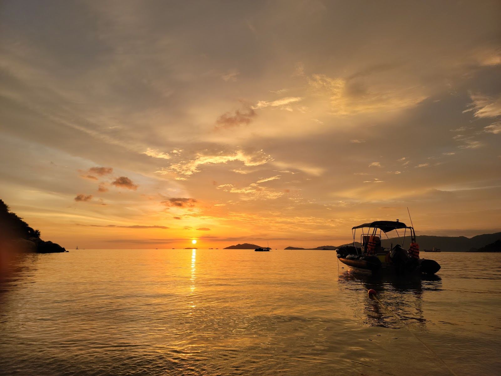 Clear turquoise water and pale sand on a quiet Koh Lipe beach