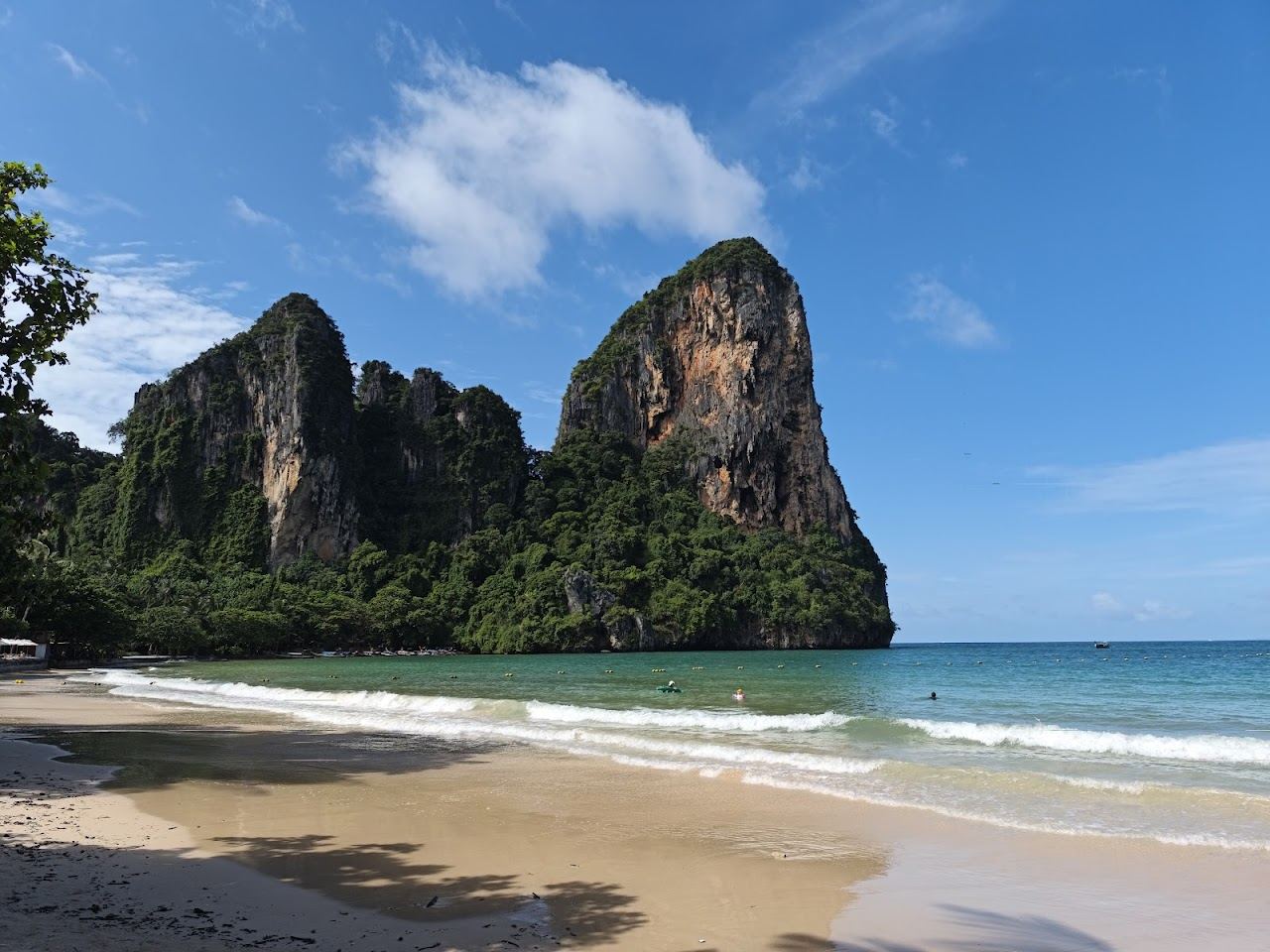 Soft sand and limestone cliffs at Railay West beach in Krabi