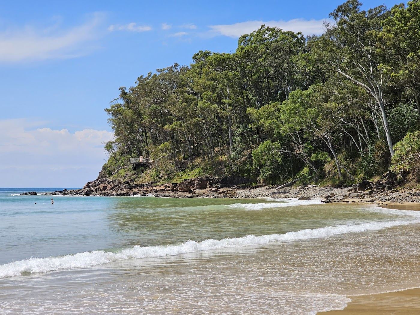 The sheltered clear water of Little Cove tucked between Noosa Main Beach and the national park