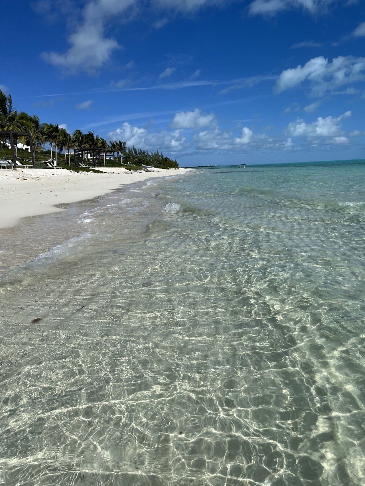 Long Bay wide shallow turquoise water and kitesurfers on the east side of Providenciales