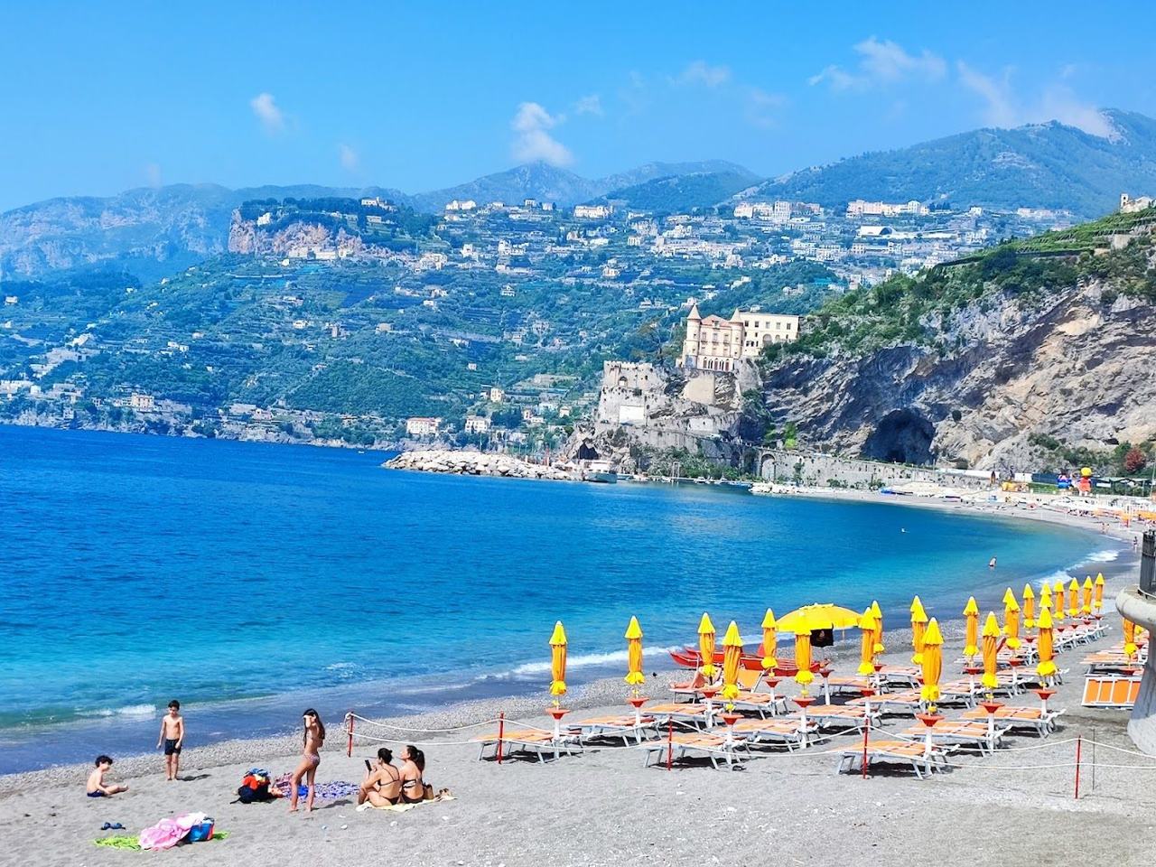 The long sandy beach and seafront promenade of Maiori on the Amalfi Coast