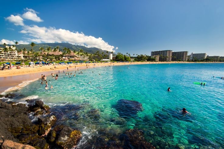 Golden sand and calm blue water along Kaanapali Beach below the resorts on the west coast of Maui Hawaii
