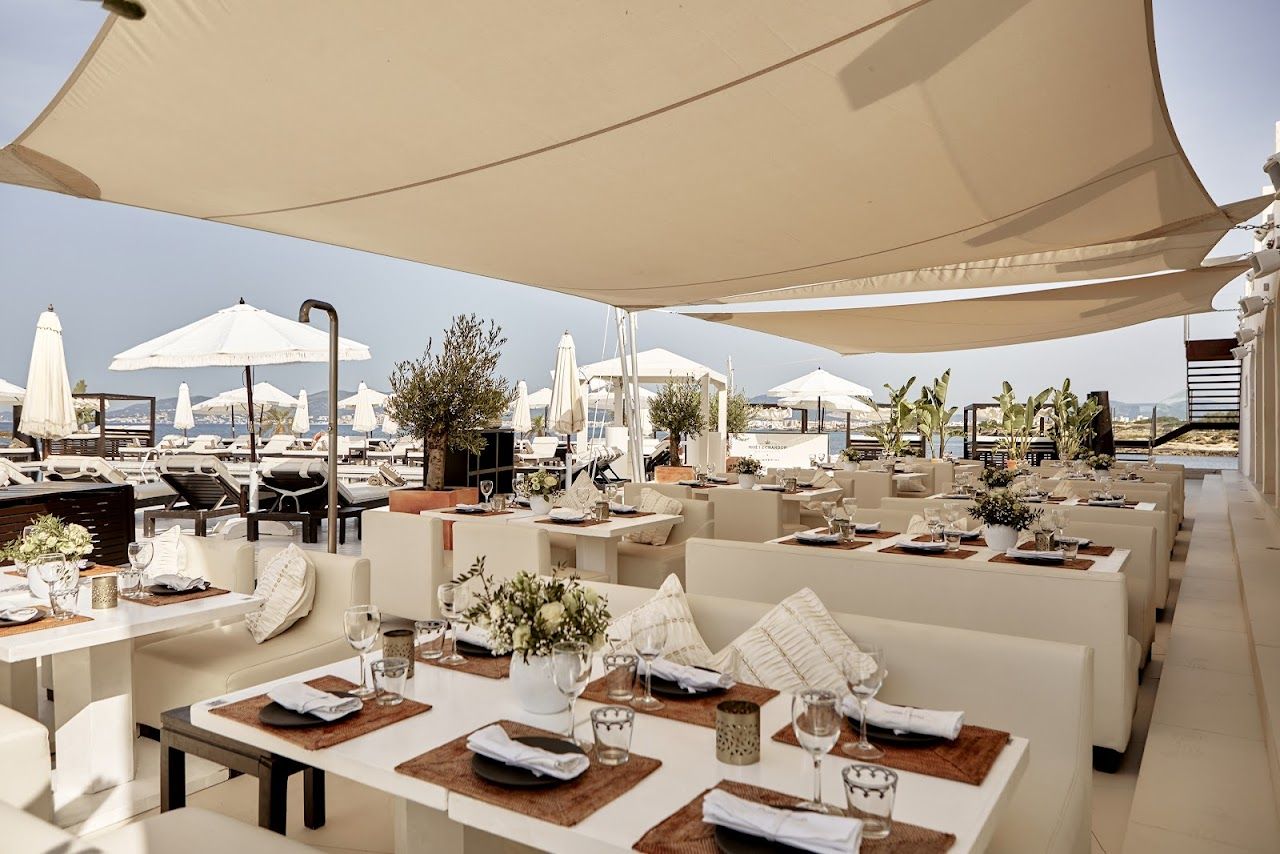 White loungers around the sea facing pool deck at Purobeach near Palma, Mallorca