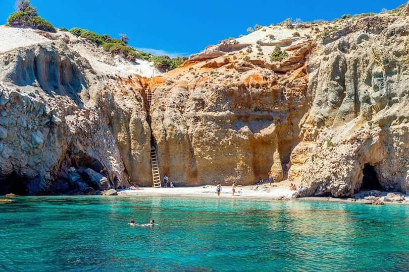 Daybeds and sunbeds at a beach club in Milos