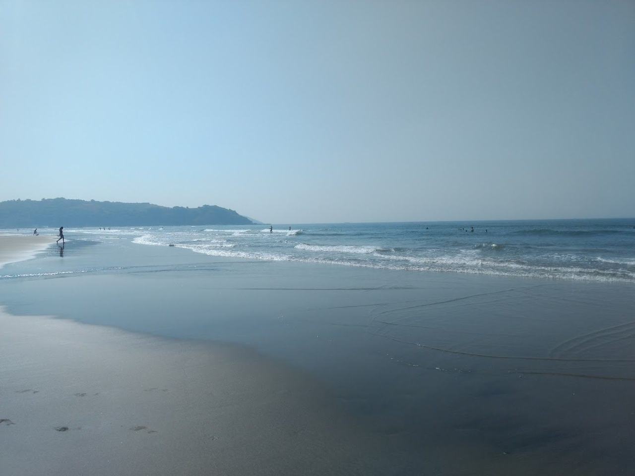 Morjim Beach wide quiet turtle nesting sand by the Chapora river mouth