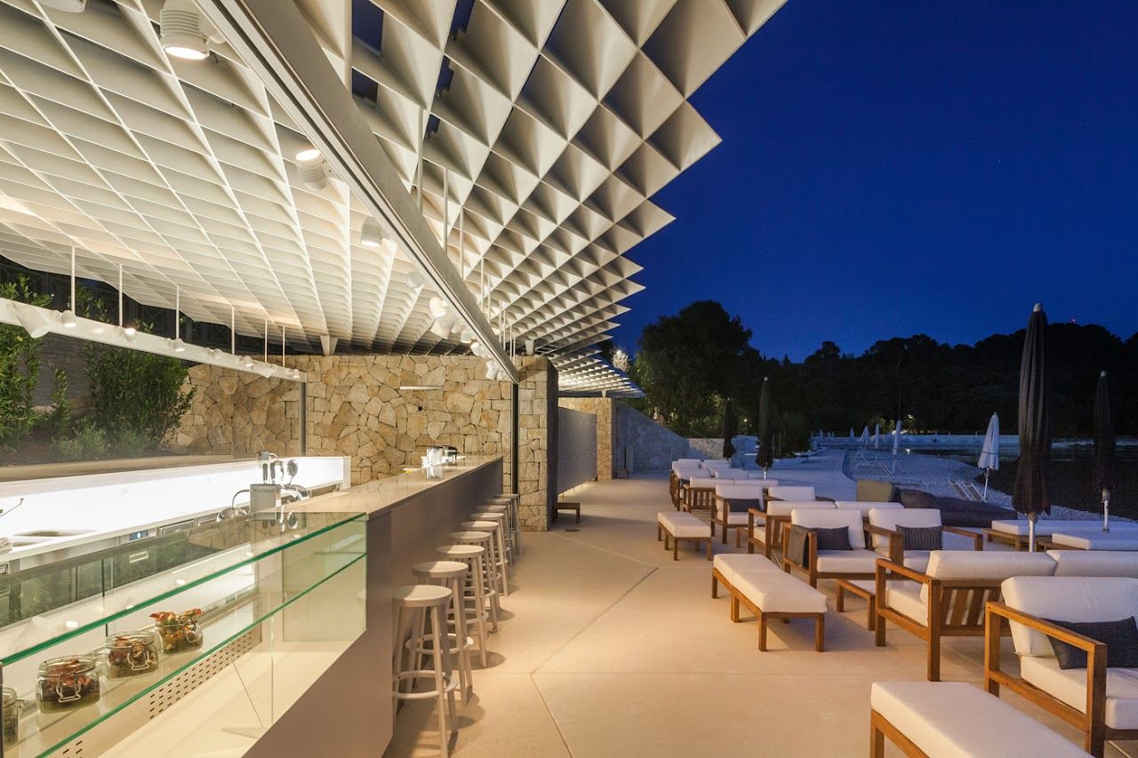 Loungers and clear water at the Mulini beach bar beside Rovinj old town