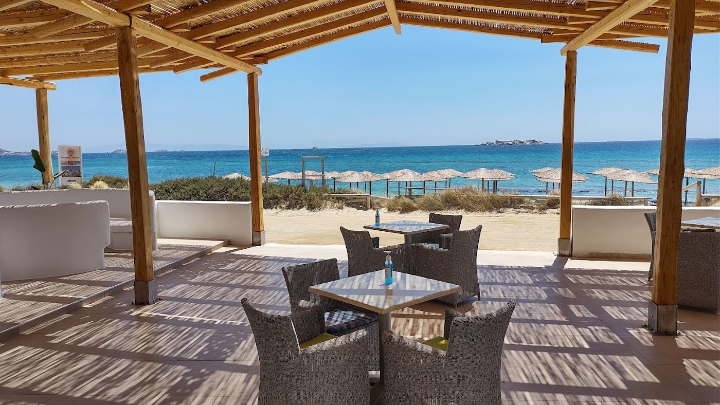 Daybeds and sunbeds at a beach club in Naxos