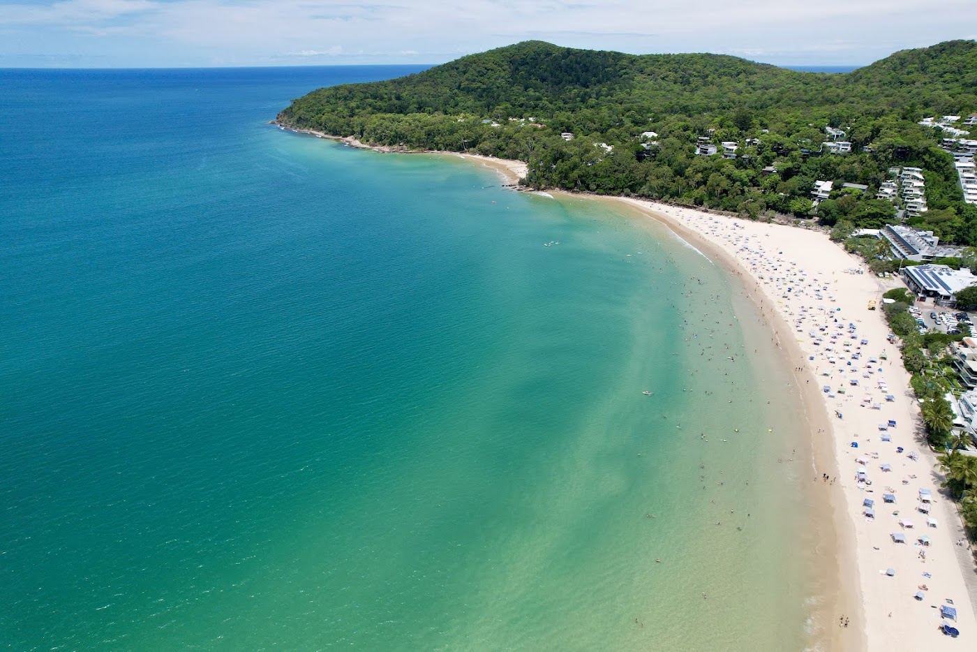 The calm north facing Main Beach at Noosa Heads with golden sand and gentle water