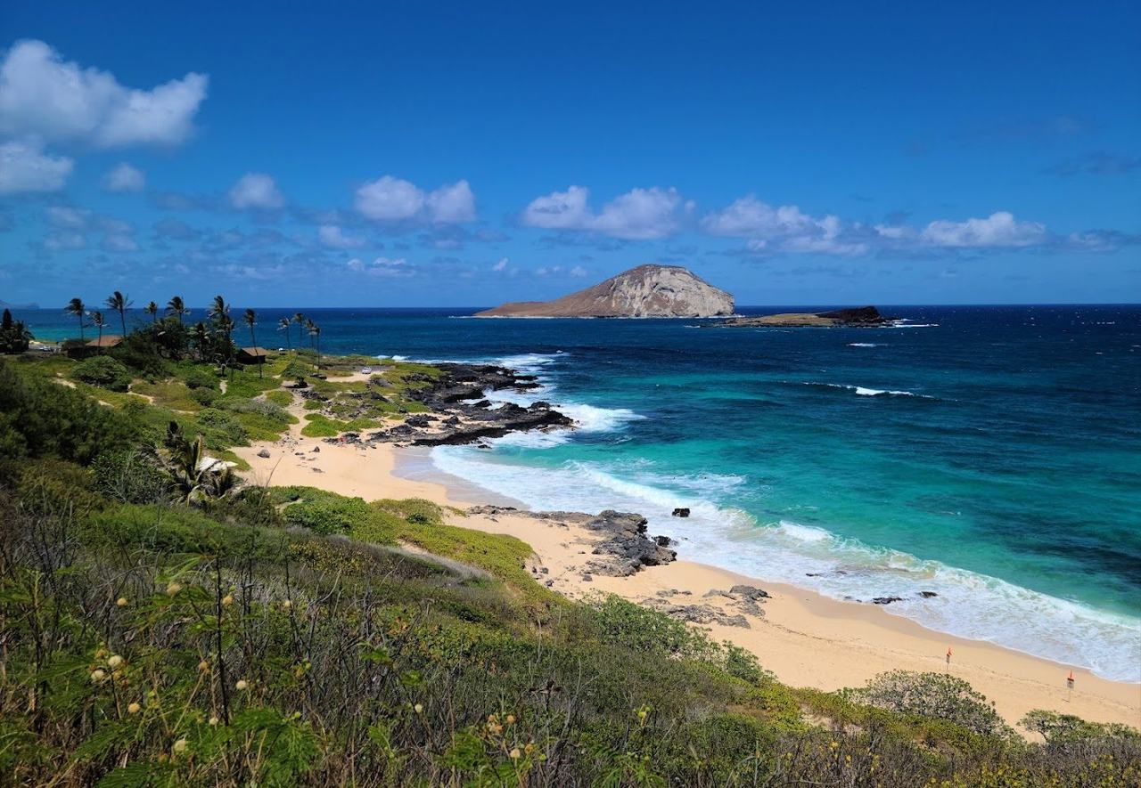 Makapuu Beach below the lighthouse headland with Rabbit Island offshore